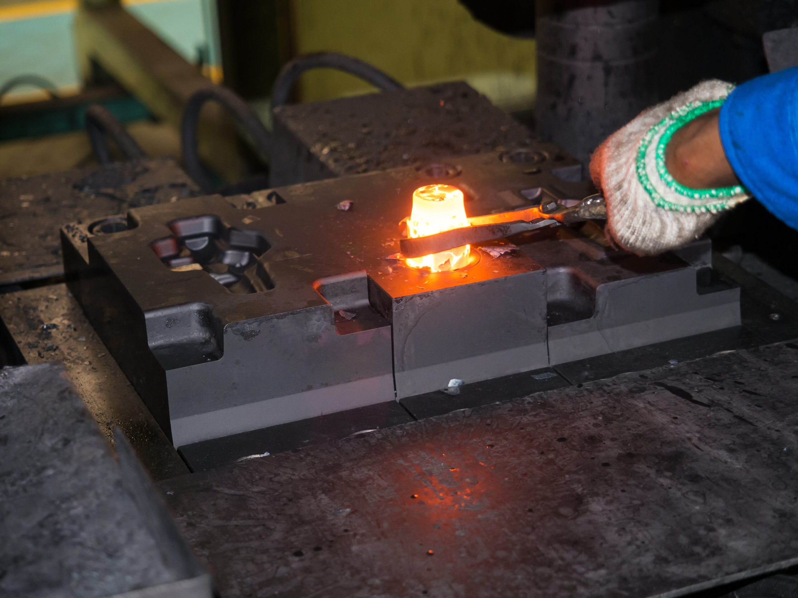 Metal tooling (made from tool steel) being used to forge an automotive part